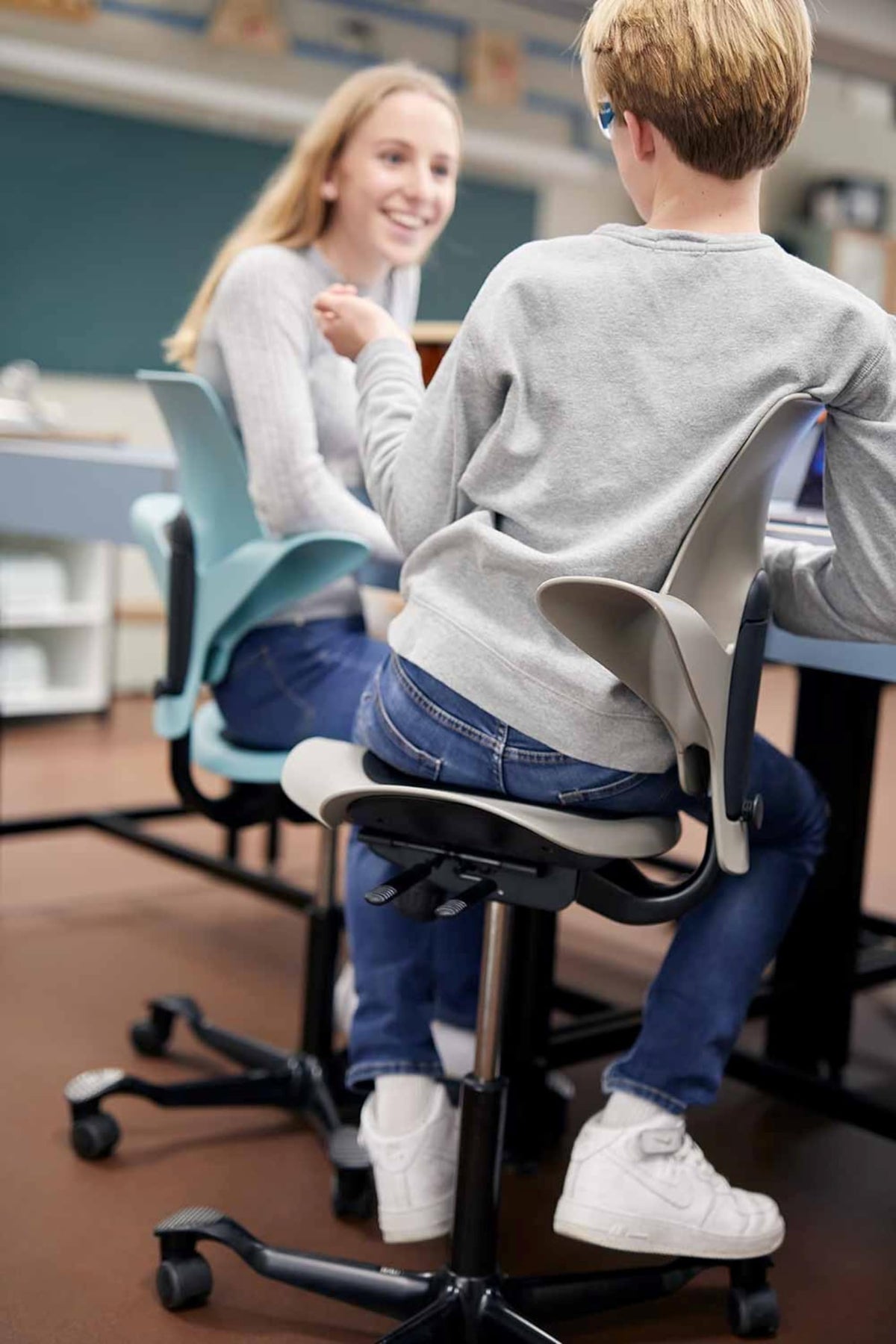 HAG Capisco Puls Adjustable Sit to Stand Desk Chair-White Frame-Blue Plastic-Blue Partial Cushion with Footring